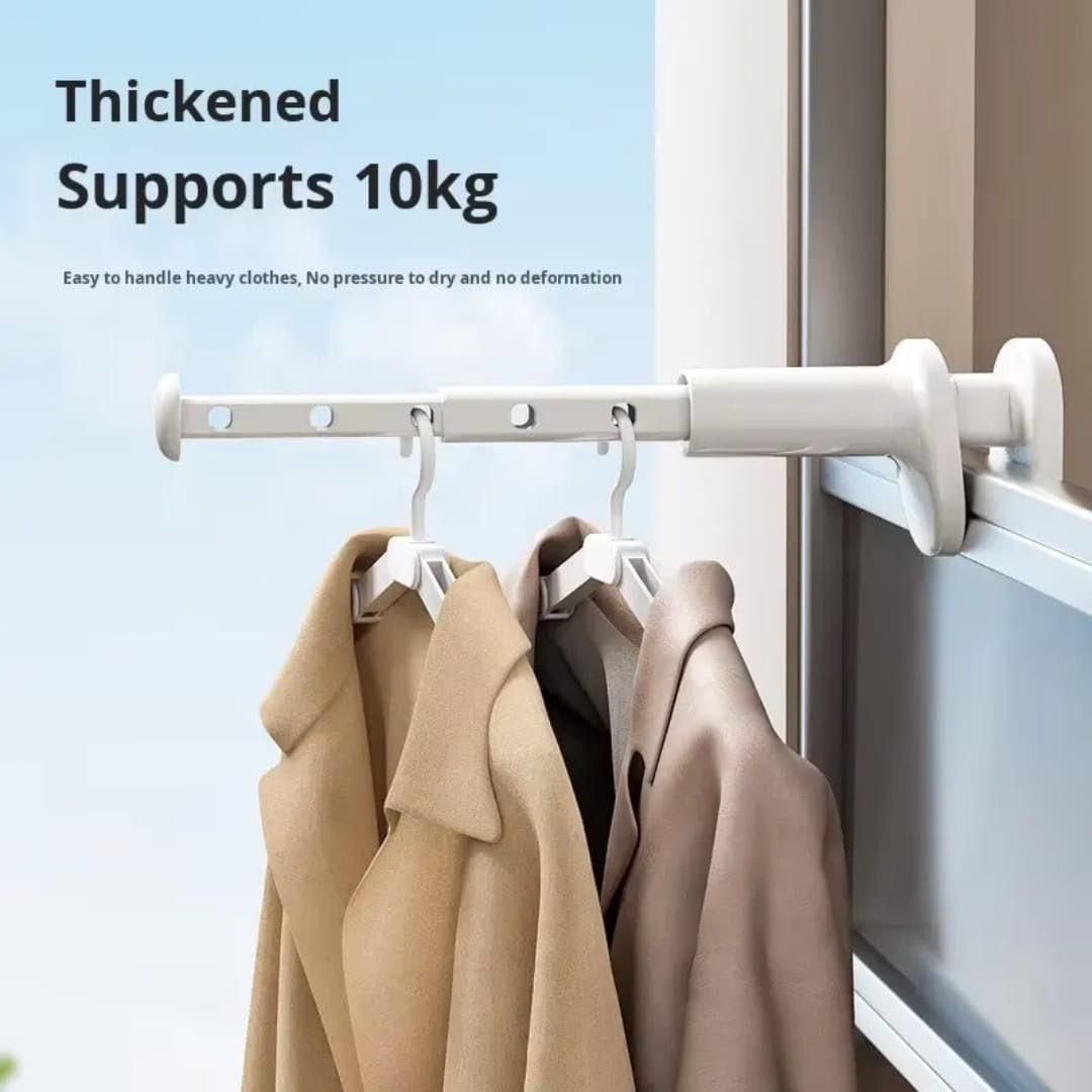 Clothing rack with coats hanging on it next to a window, with text indicating weight support.