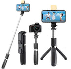 Multi-function camera and phone holder with tripod and selfie stick on a white background